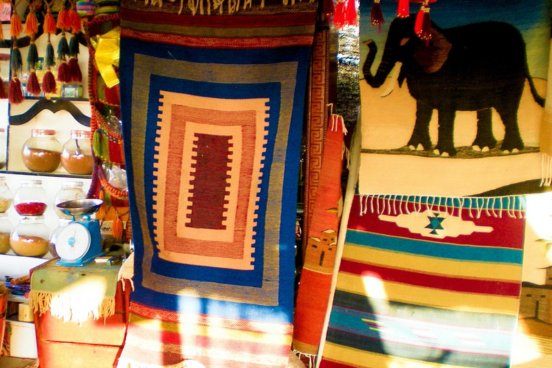 Elephant Design Carpet And Box Design Carpet Are Hanging on Wall in Store