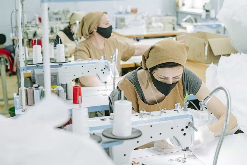 A Group of Woman Doing Sewing Work By Using Machines