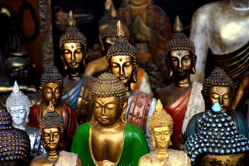 so many buddha statue in the store
