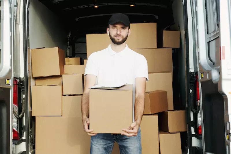 A man is holding box 