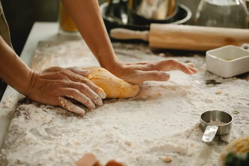 A girl is mixing flour