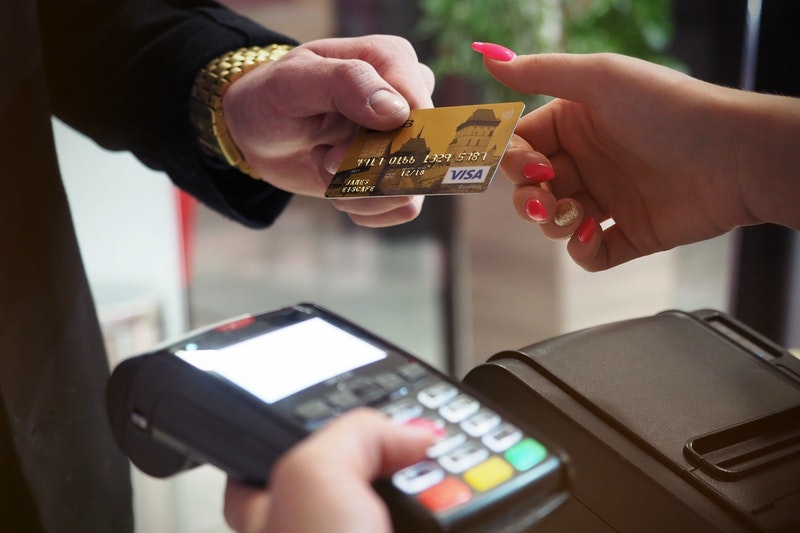 A man doing transaction with bank card.