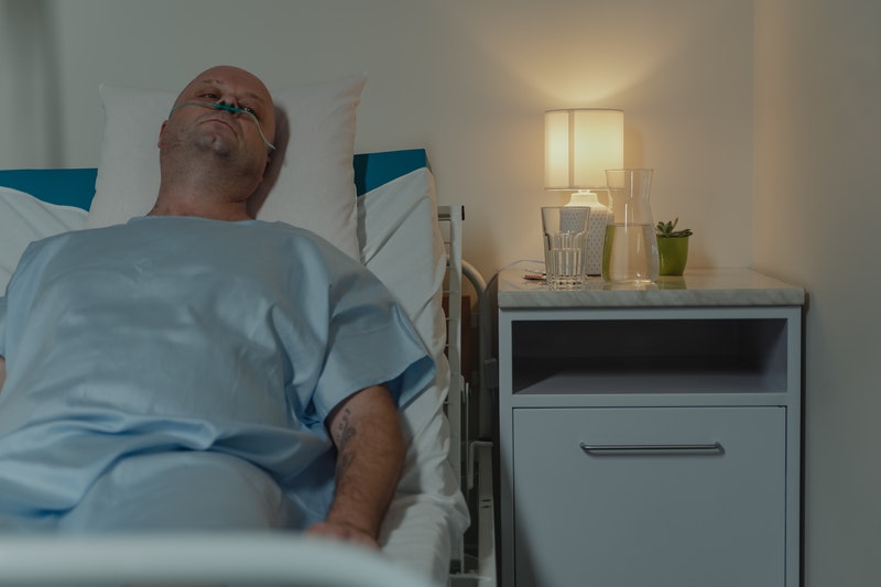 A patient resting on bed in the hospital.