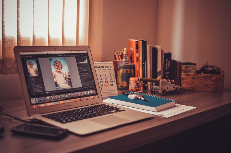A laptop is placed on the table.