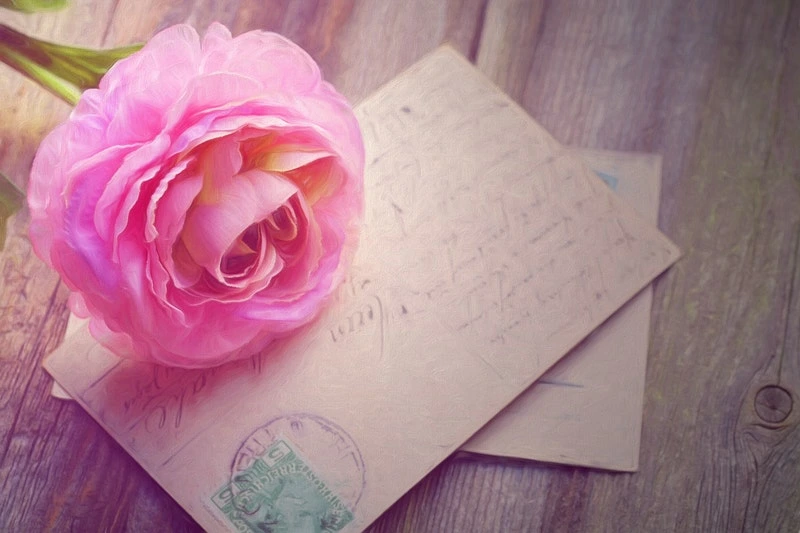 A Rose and letter is placed in the picture