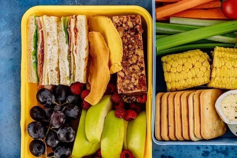 Sandwiches, fruits and all snacks items are placed in the tiffin box