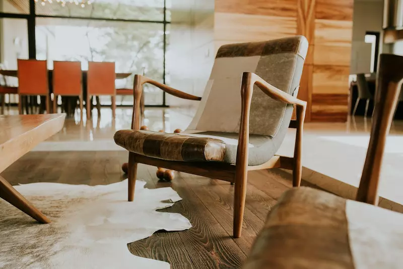 Leather furniture and faux leather rugs is shown in the image