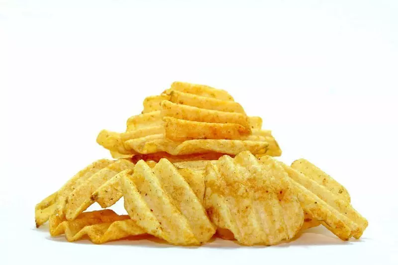 Potato chips with plain white background.