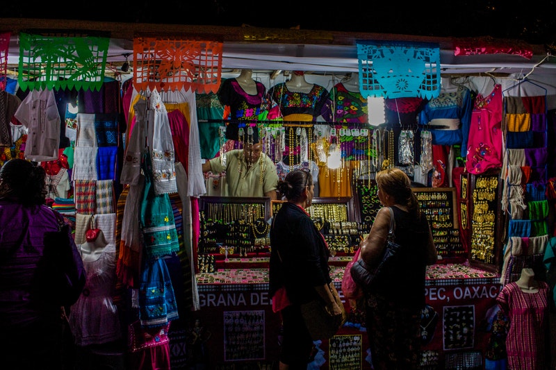 A lady buying jewellery from the store