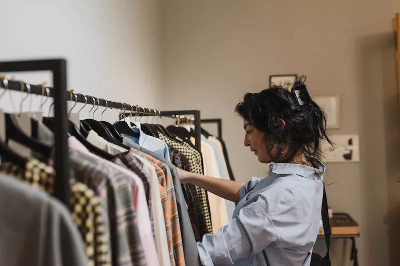 A lady buying clothes from boutique shop