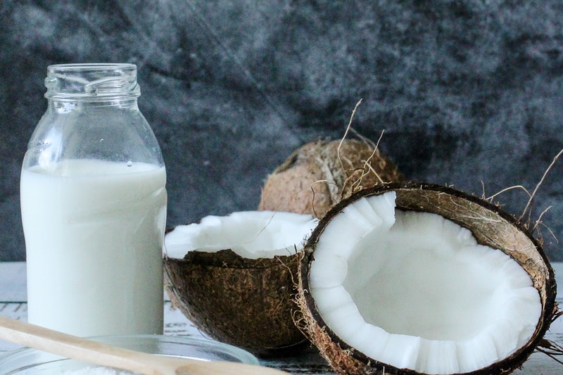 A bottle filled with coconut milk.