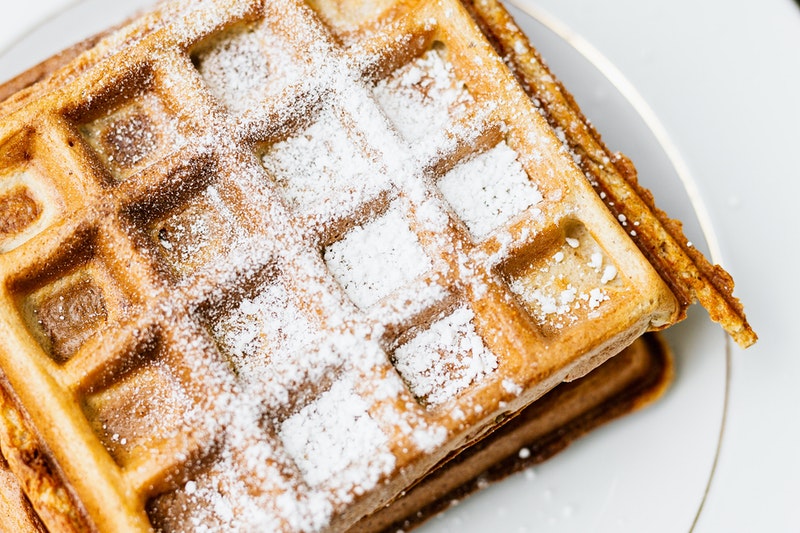 Custard powder sprinkled on the waffle.
