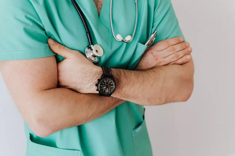 A doctor is shown on the display