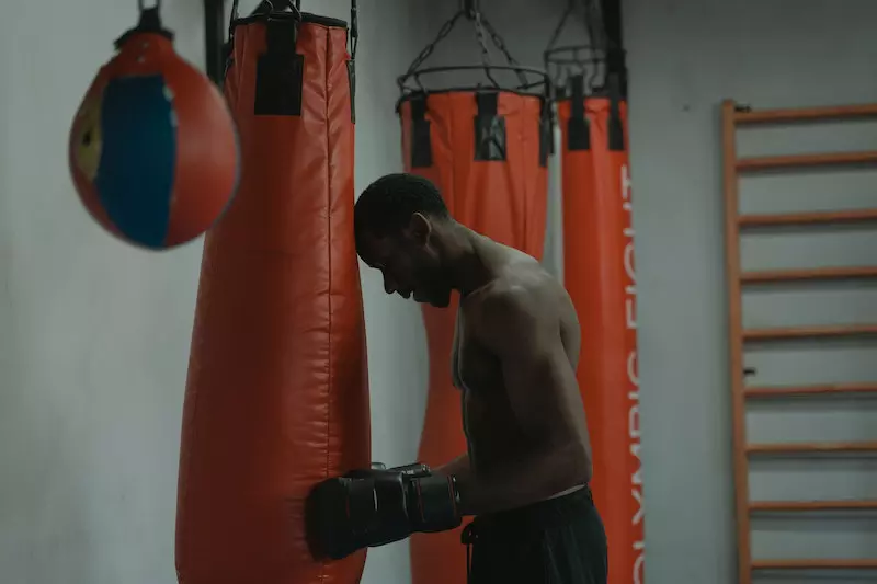 A man is practicing boxing 