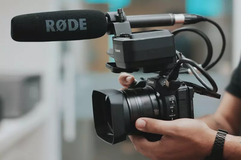A man is holding camera 