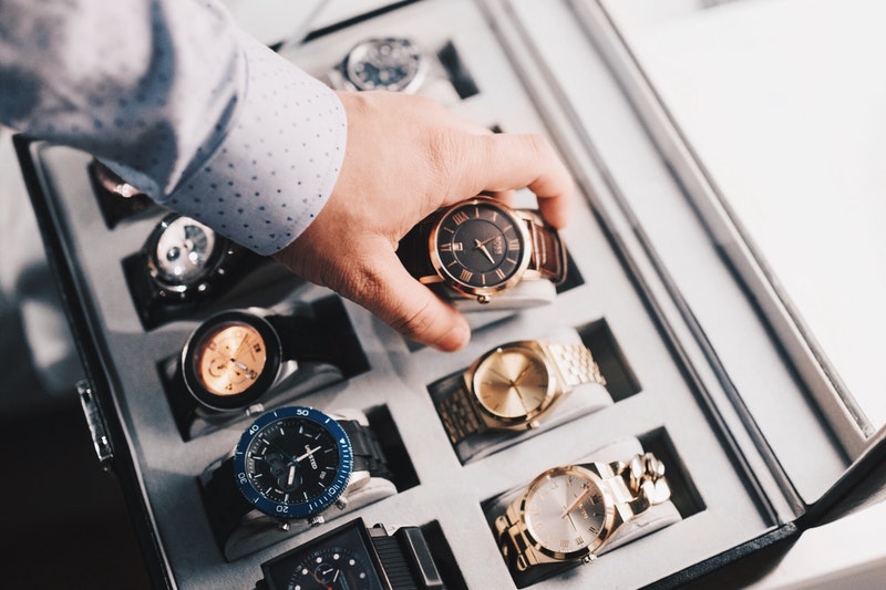 A number of watches are placed in the box.