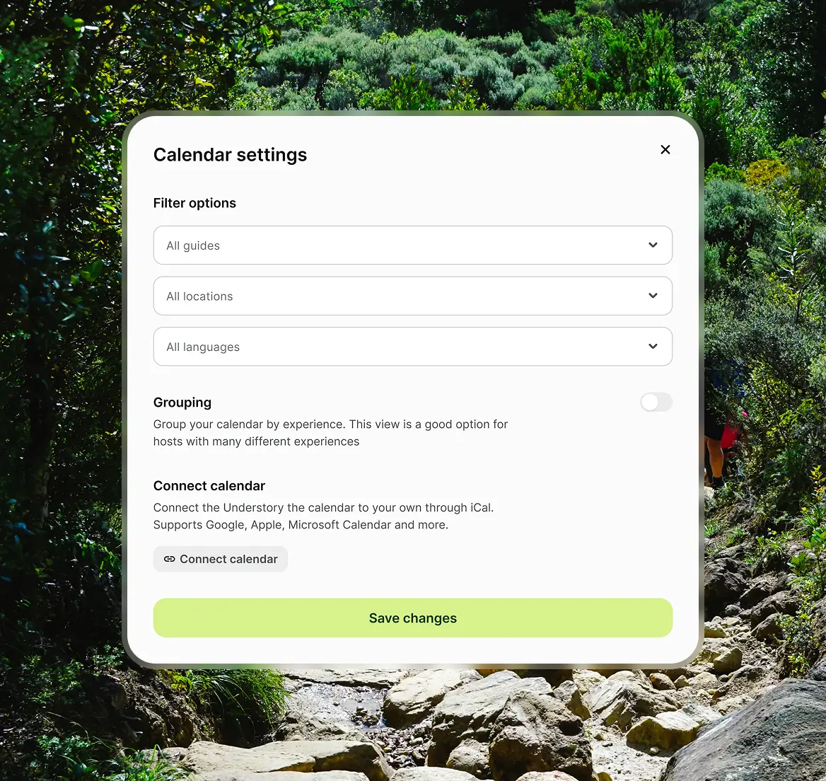 Calendar settings popup with filter options for guides, locations, languages, grouping toggle, and connect calendar button, over a rocky forest trail background.