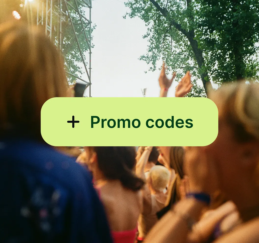 Crowd at an outdoor event with a green button labeled '+ Promo codes' overlayed.