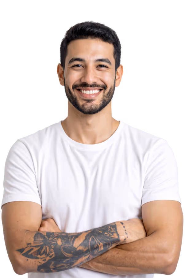 Smiling man with a short black hair, black beard and tattooed right arm wearing a white t-shirt.