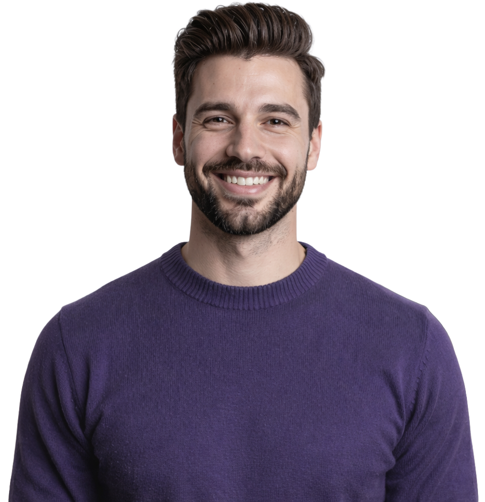 Smiling young man with dark hair and beard wearing a purple sweater against a plain background.