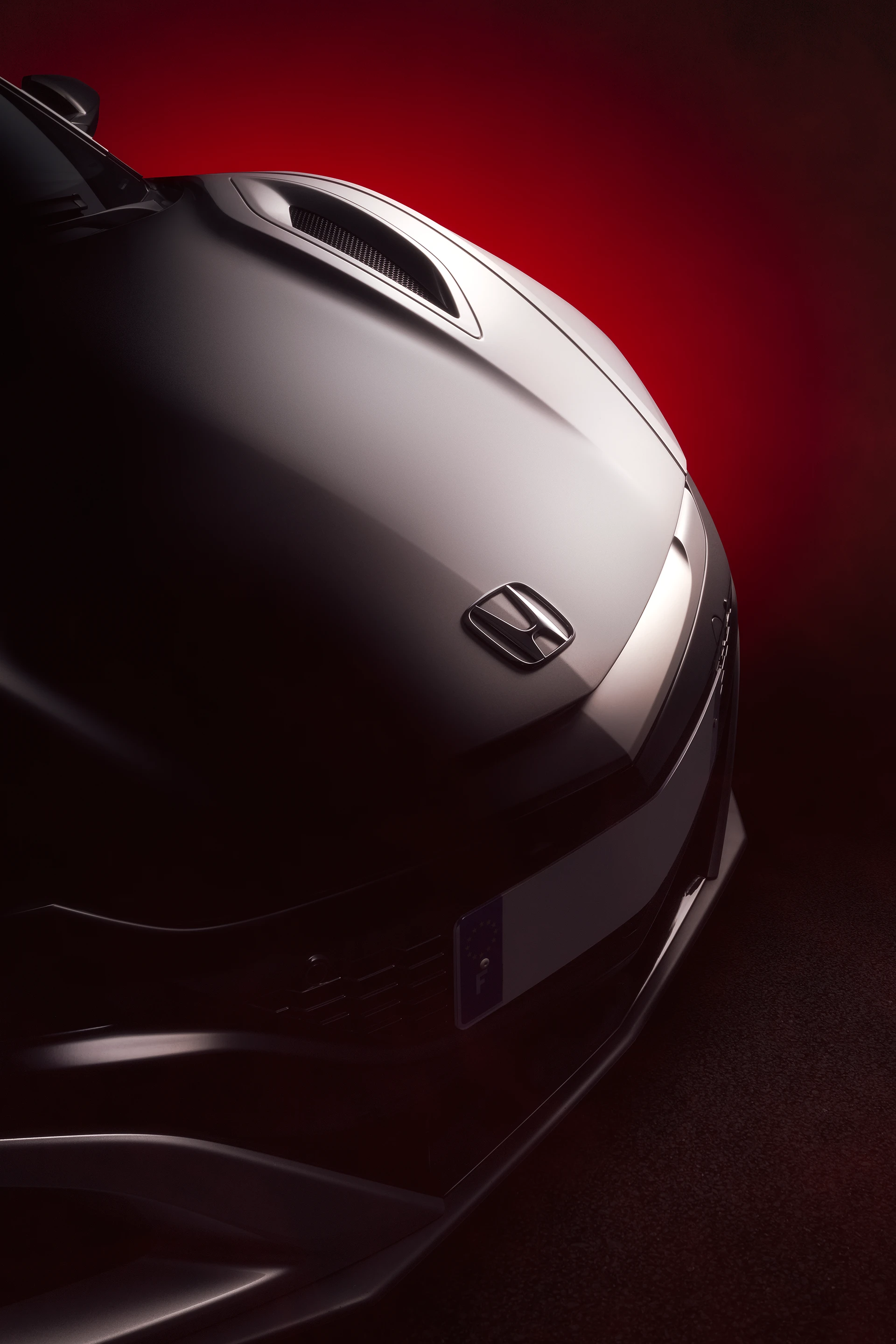 Capot avant d'une Honda NSX (NC1) grise avec la technique FDL