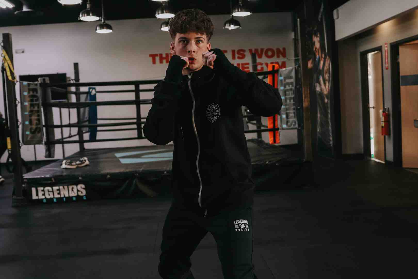 A boxer demonstrating a perfect, balanced boxing stance, ready for action. - boxing skills for beginners
