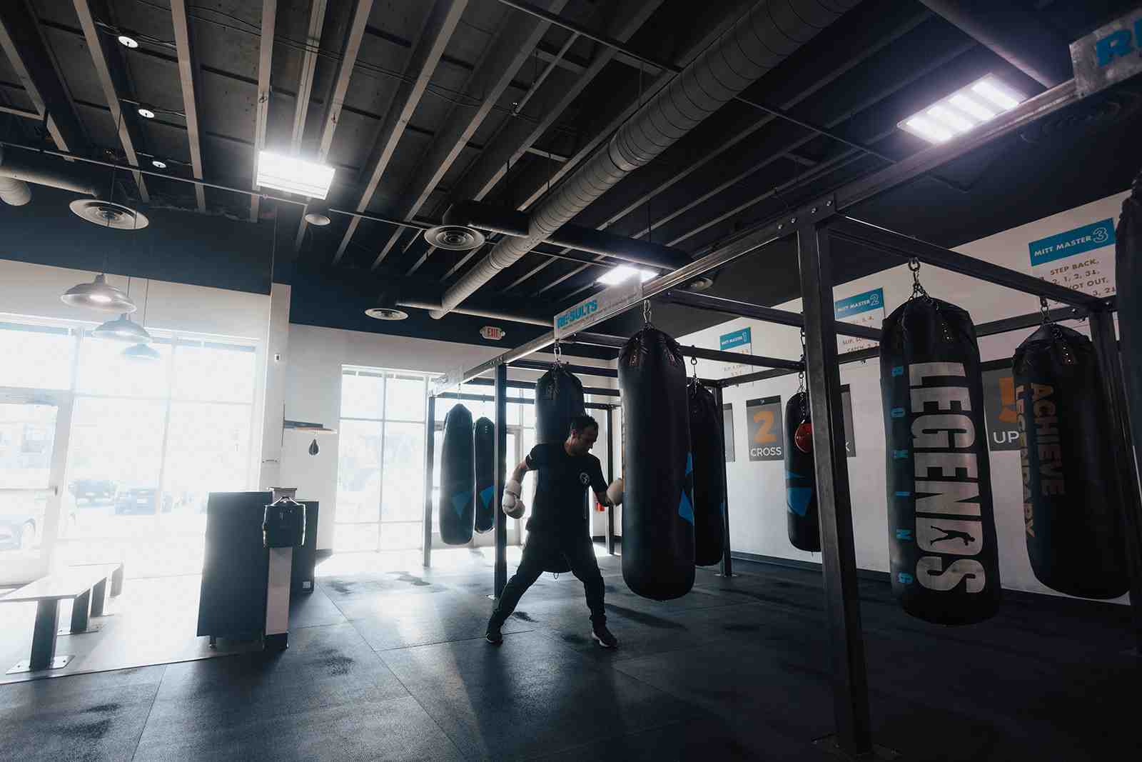 Legends Boxing gym interior showing a clean and welcoming space with heavy bags and training areas - boxing classes utah