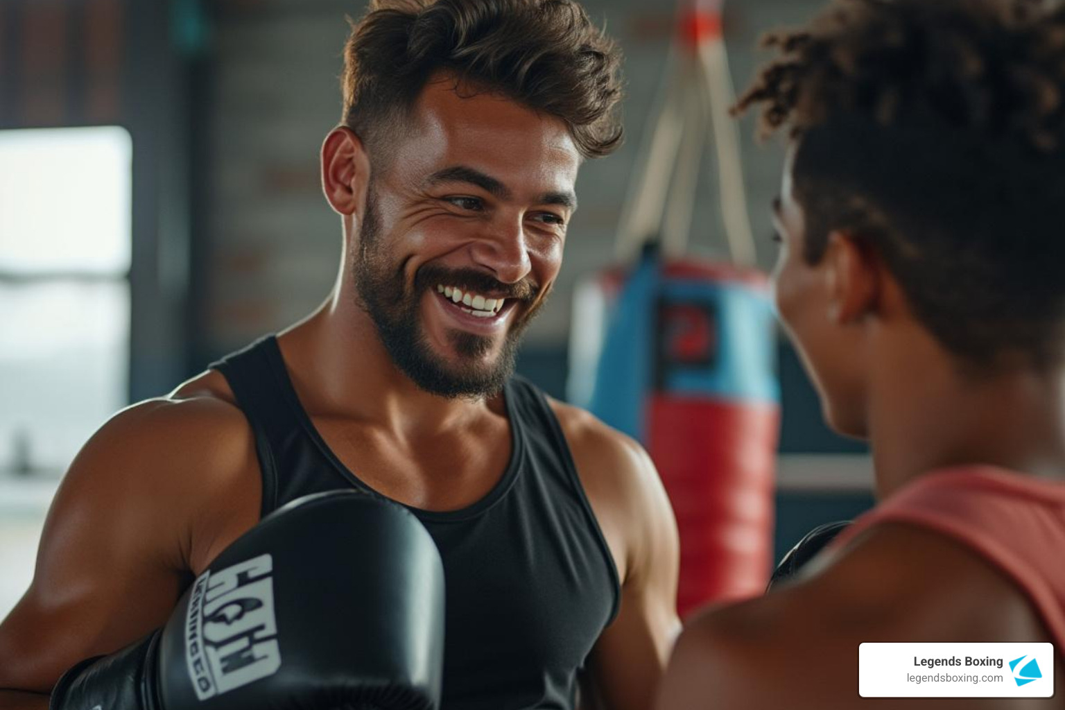 A friendly coach talking with a new student in a gym setting - private boxing lessons utah