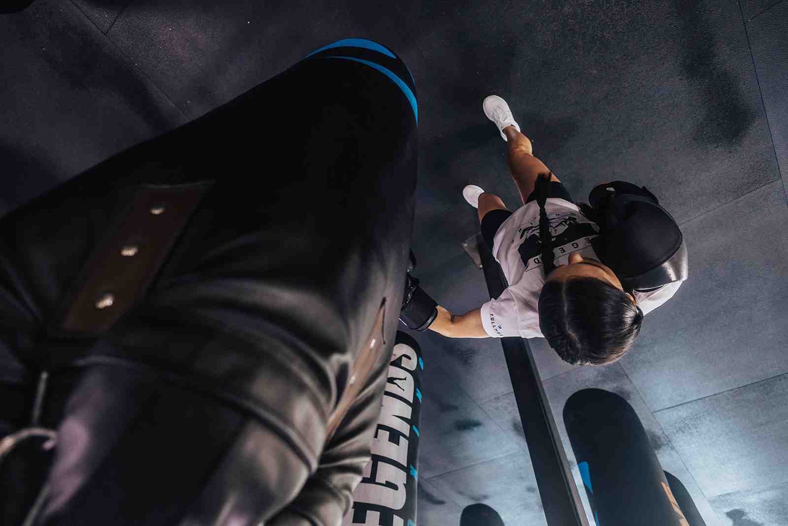 Person hitting a heavy bag with intensity - boxing gym sandy utah