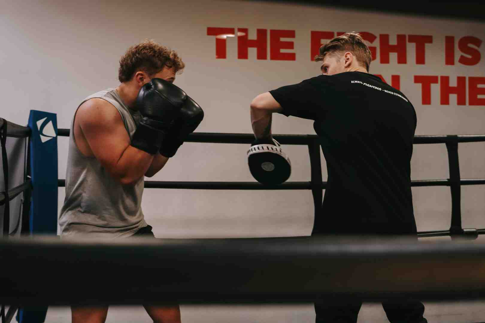 Legends Boxing coach working one-on-one with a member on mitts - boxing gym orem utah