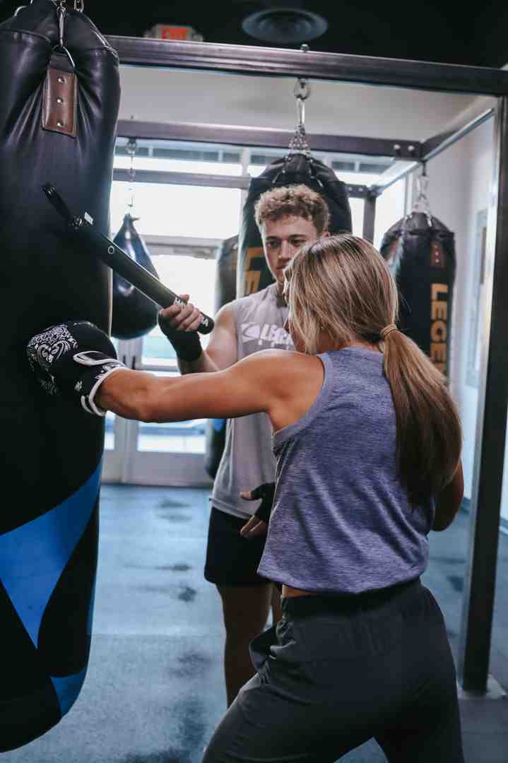 coach giving instruction - fighting gyms near me