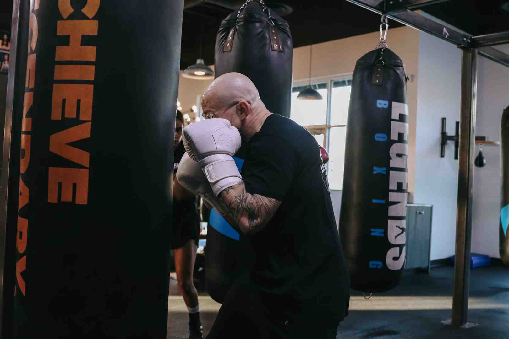 boxer executing a perfect jab on a heavy bag - boxing moves to learn boxer executing a perfect jab on a heavy bag - boxing moves to learn