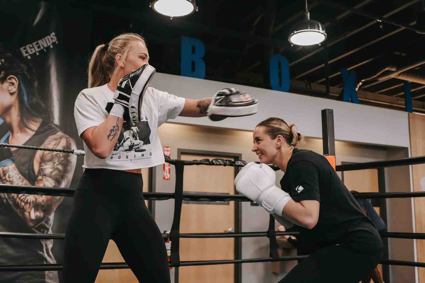 two people practicing a jab-cross combination with focus mitts - boxing moves to learn two people practicing a jab-cross combination with focus mitts - boxing moves to learn