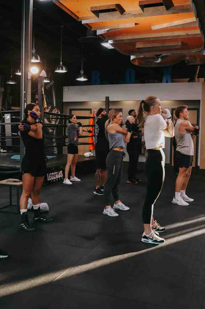 A diverse group of people enjoying a high-energy boxing fitness class with boxing benefits, Draper fitness, getting started, and full-body workout themes - boxing gyms draper utah A diverse group of people enjoying a high-energy boxing fitness class with boxing benefits, Draper fitness, getting started, and full-body workout themes - boxing gyms draper utah