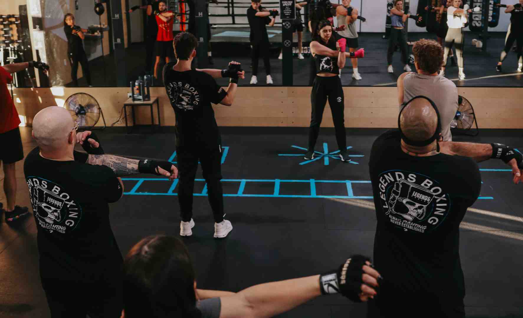 Person shadowboxing in front of a mirror, focusing on form - good boxing moves Person shadowboxing in front of a mirror, focusing on form - good boxing moves