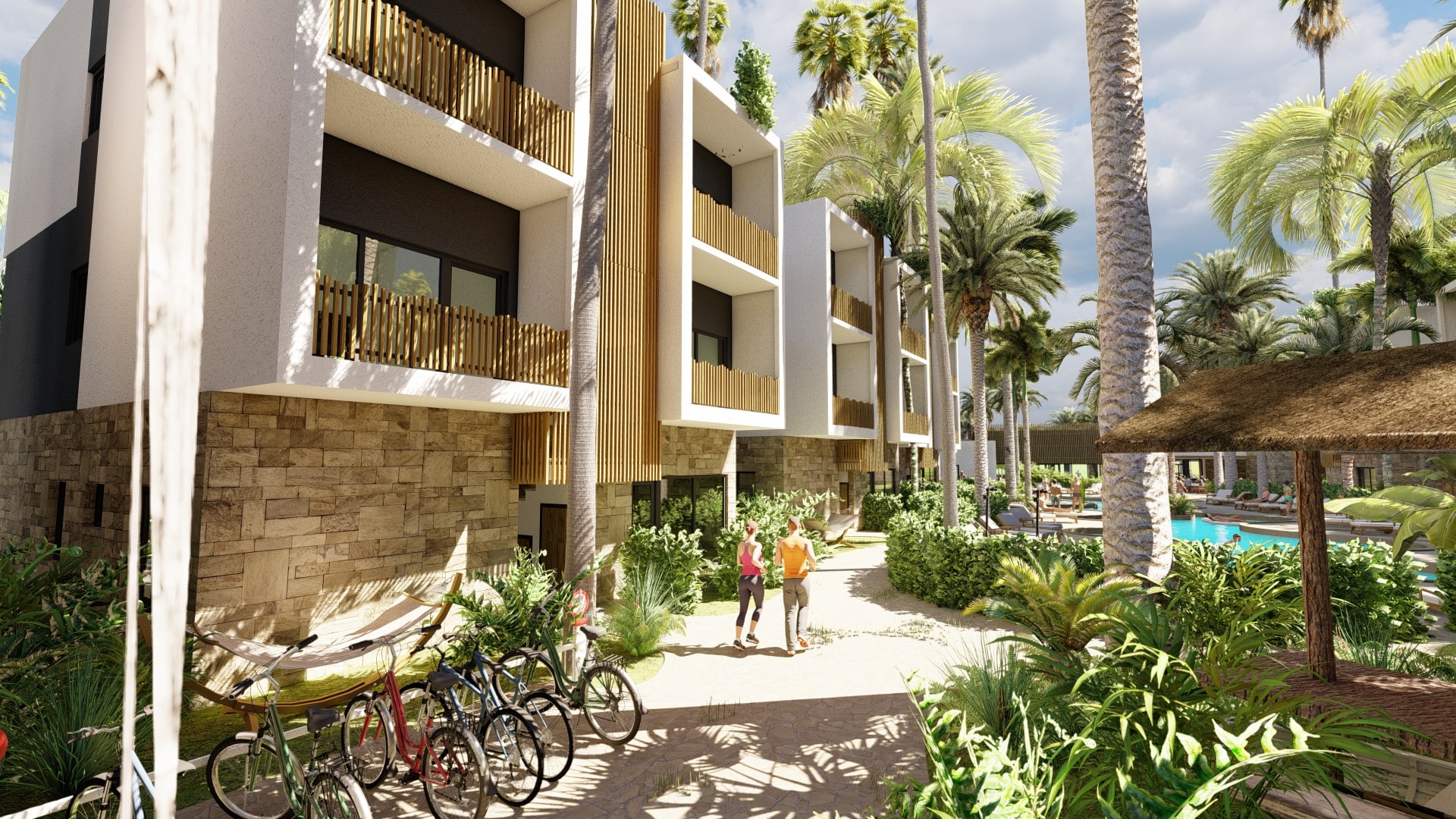 A sunlit pathway at the VELA resort, featuring rows of contemporary buildings with stone accents and wooden railings, a group of bicycles, and two people walking.