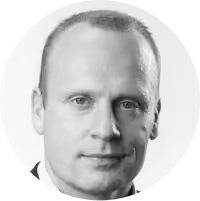 A man with a bald head and a white shirt.