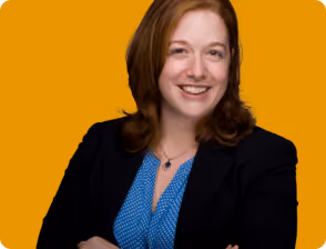 A woman with red hair and a blue shirt.