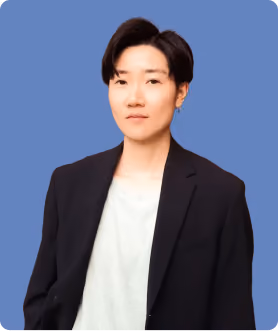 A man wearing a black suit and a white shirt.
