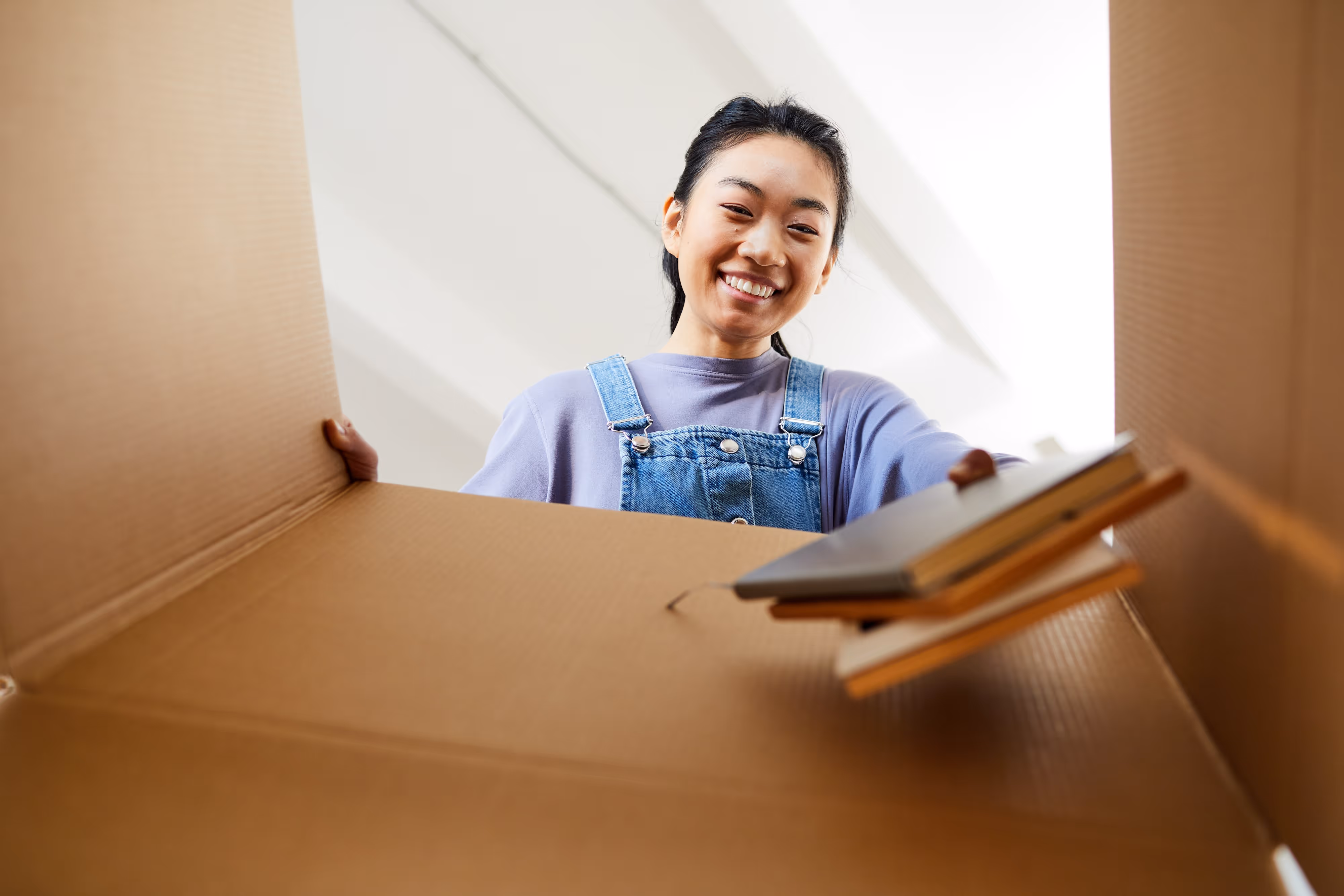 female student packing for college