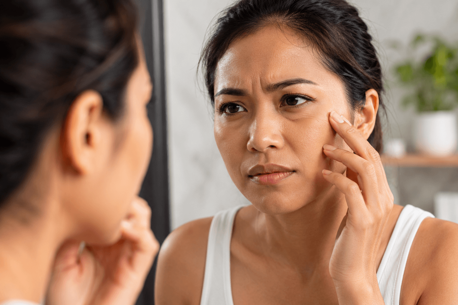 Client consultation for Morpheus8 treatment addressing fine lines and facial sagging in Costa Mesa, California