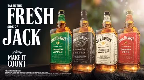 Four bottles of different flavours of Jack Daniels