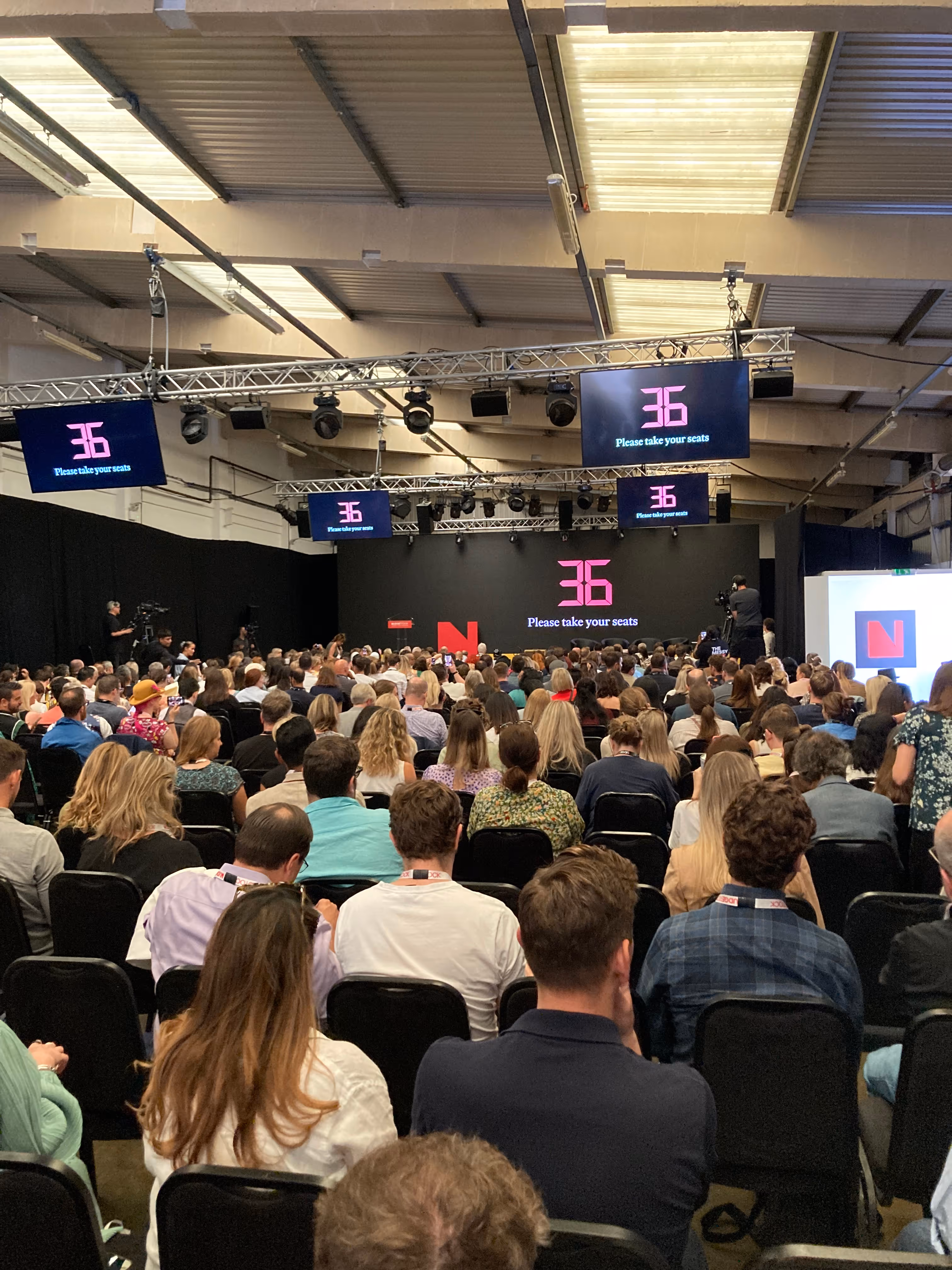 Large group of people in Nudgestock conference hall