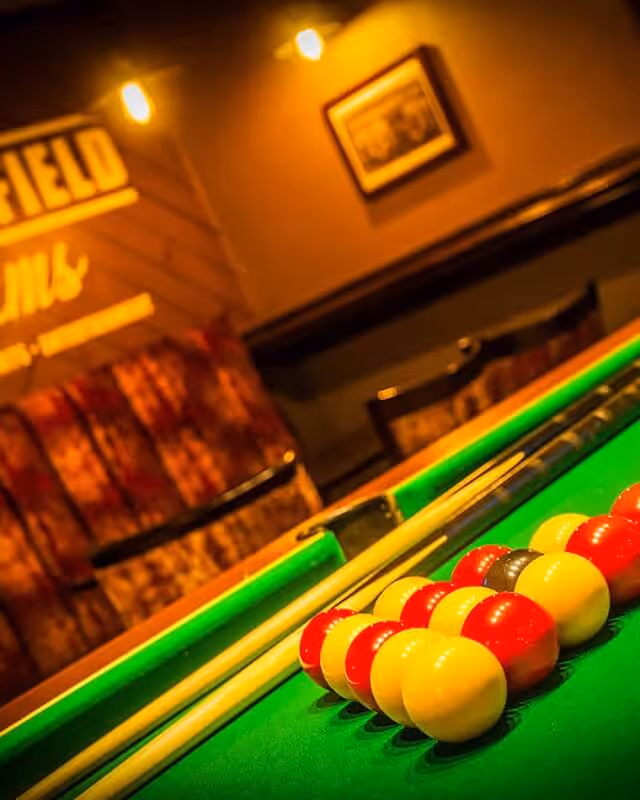 A well lit pool table