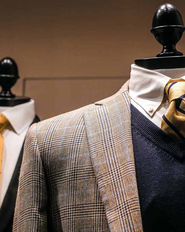 Two mannequins dressed in suits