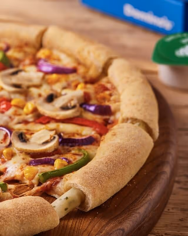 Pizza with mushroom, sweetcorn, onion and pepper toppings