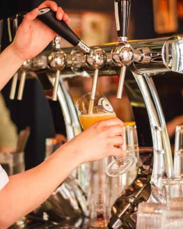 A pint of lager being poured