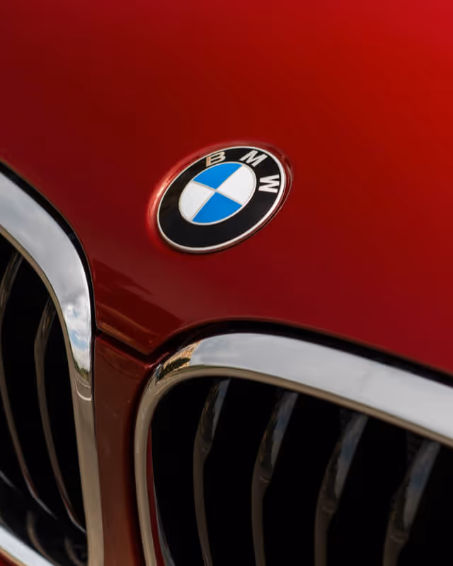 Close up of BMW badge on red car
