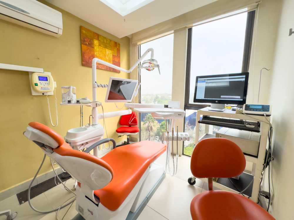 Dental chair with a light overhanging. A large window with view over the city. 