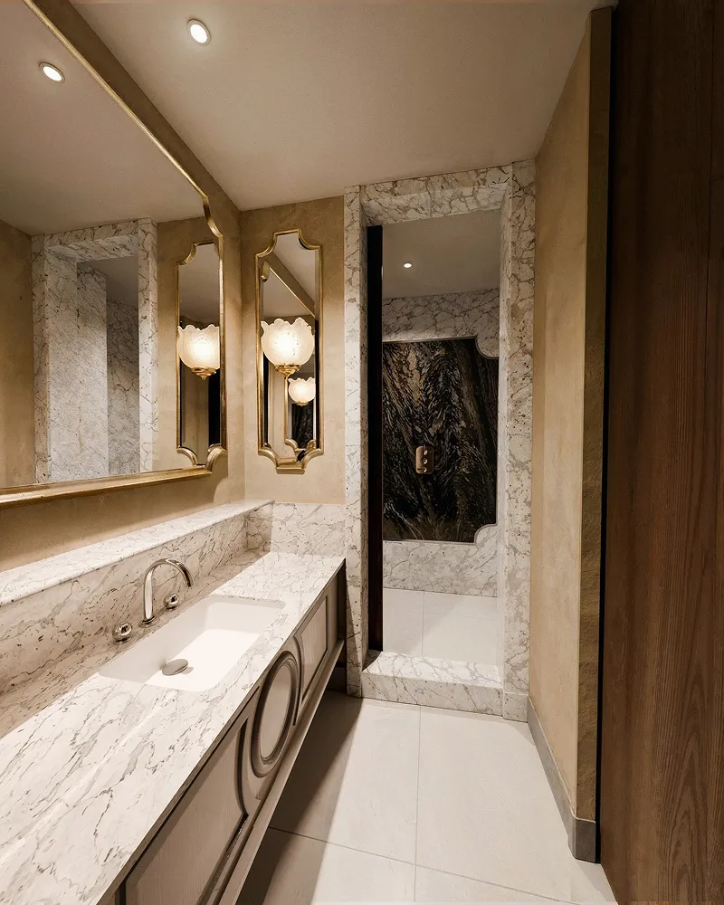 L’Aventure bathroom with a washbasin, mirrors and marble surfaces.